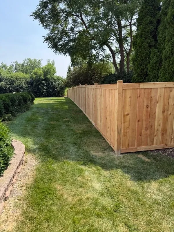 wood stockade fence installed by top rail fence