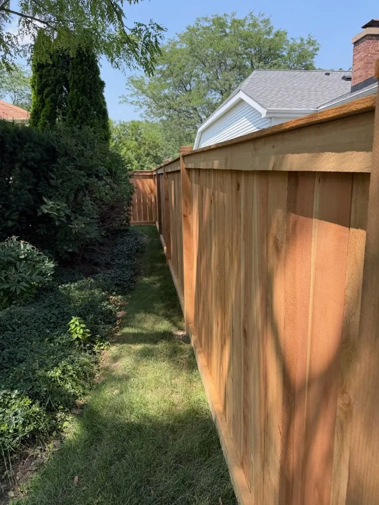 wood stockade fence installed by top rail fence
