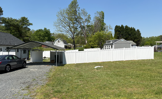 vinyl privacy fence installed by top rail fence
