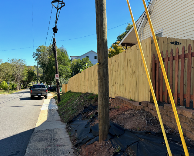 wood stockade fence installed by top rail fence