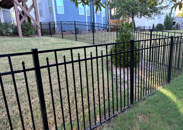 ornamental metal fence installed by top rail fence