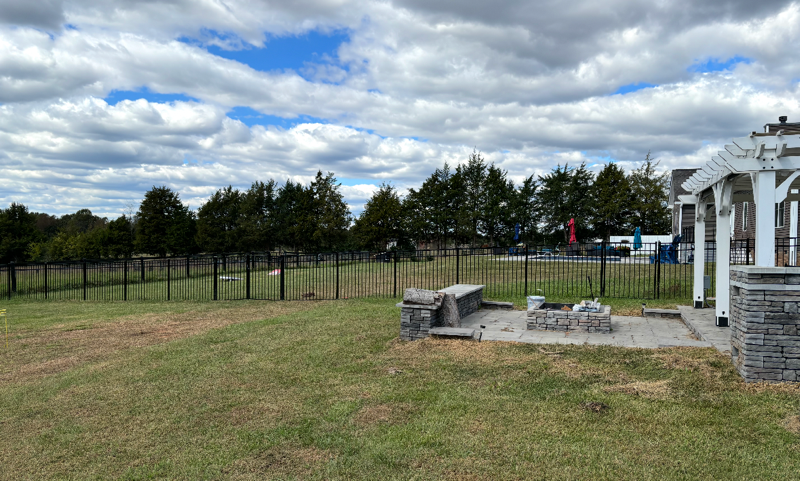 ornamental metal fence installed by top rail fence