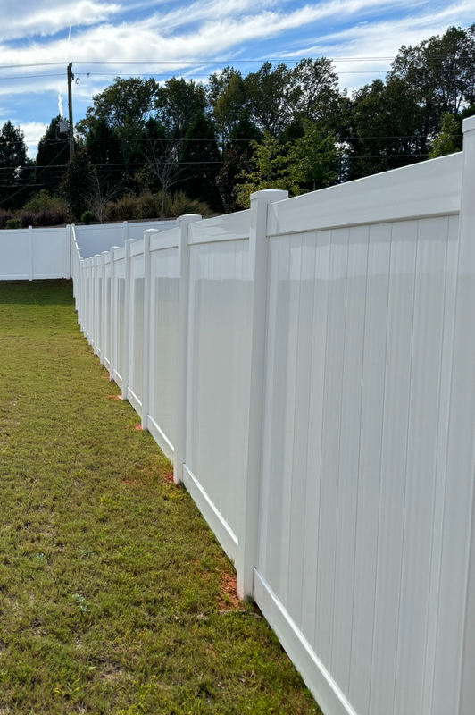 vinyl privacy fence installed by top rail fence