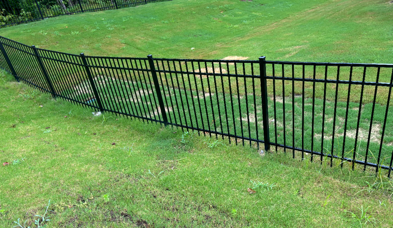 ornamental metal fence installed by top rail fence