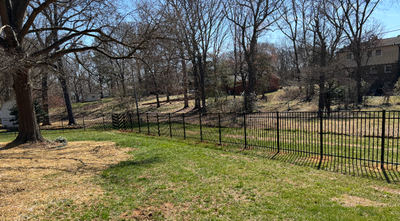 ornamental metal fence installed by top rail fence