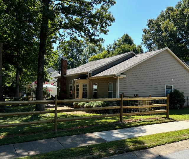 wood ranch rail fence installed by top rail fence