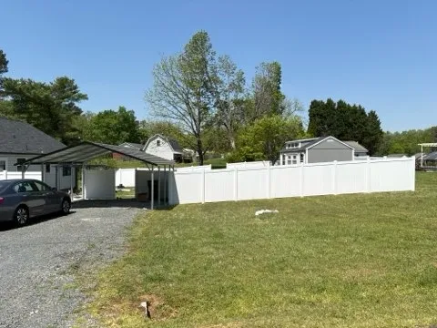vinyl privacy fence installed by top rail fence