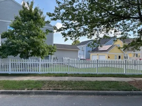 vinyl picket fence installed by top rail fence