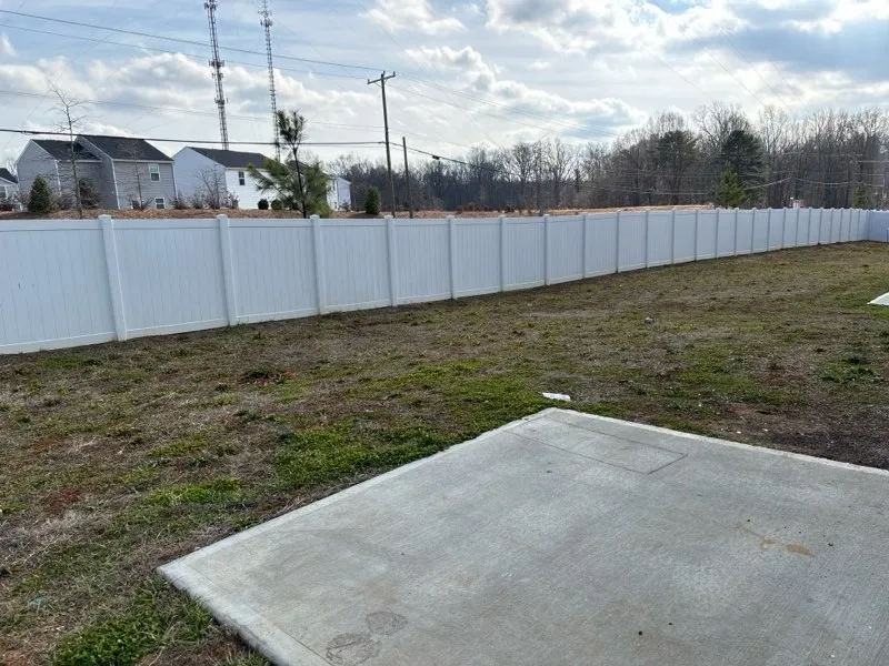 vinyl privacy fence installed by top rail fence