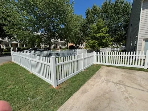 vinyl picket fence installed by top rail fence