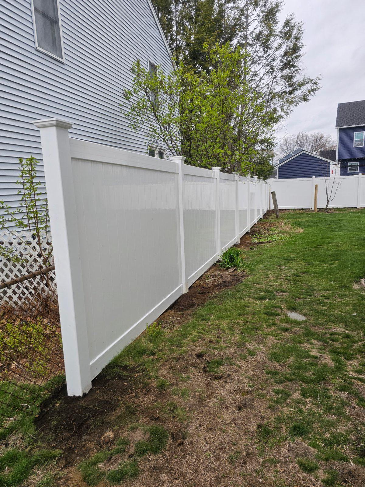 vinyl privacy fence installed by top rail fence