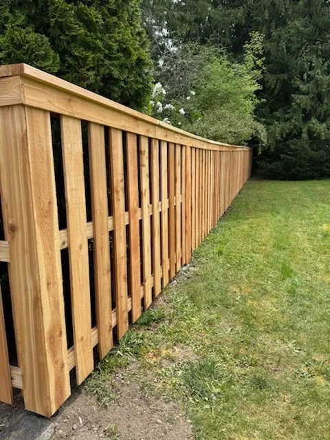 wood shadowbox fence installed by top rail fence