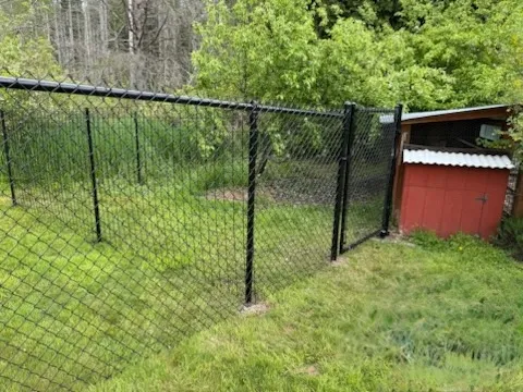 black chain link fence installed by top rail fence