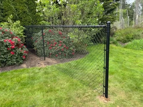 black chain link fence installed by top rail fence