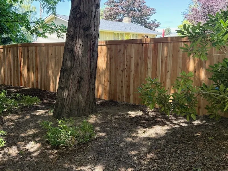 wood stockade fence installed by top rail fence