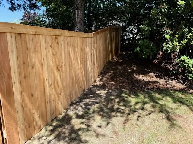 wood stockade fence installed by top rail fence