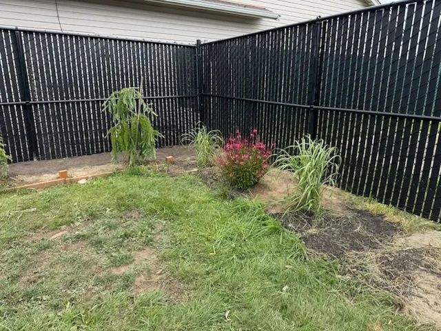 chain link fence installed by top rail fence