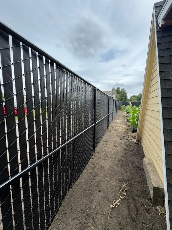 chain link fence installed by top rail fence