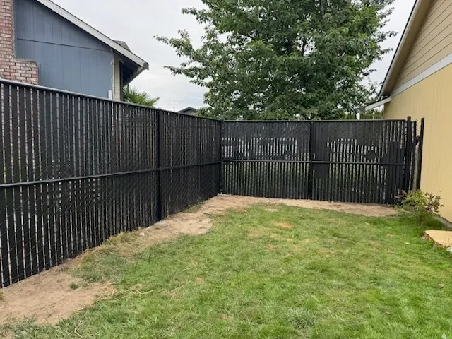 chain link fence installed by top rail fence