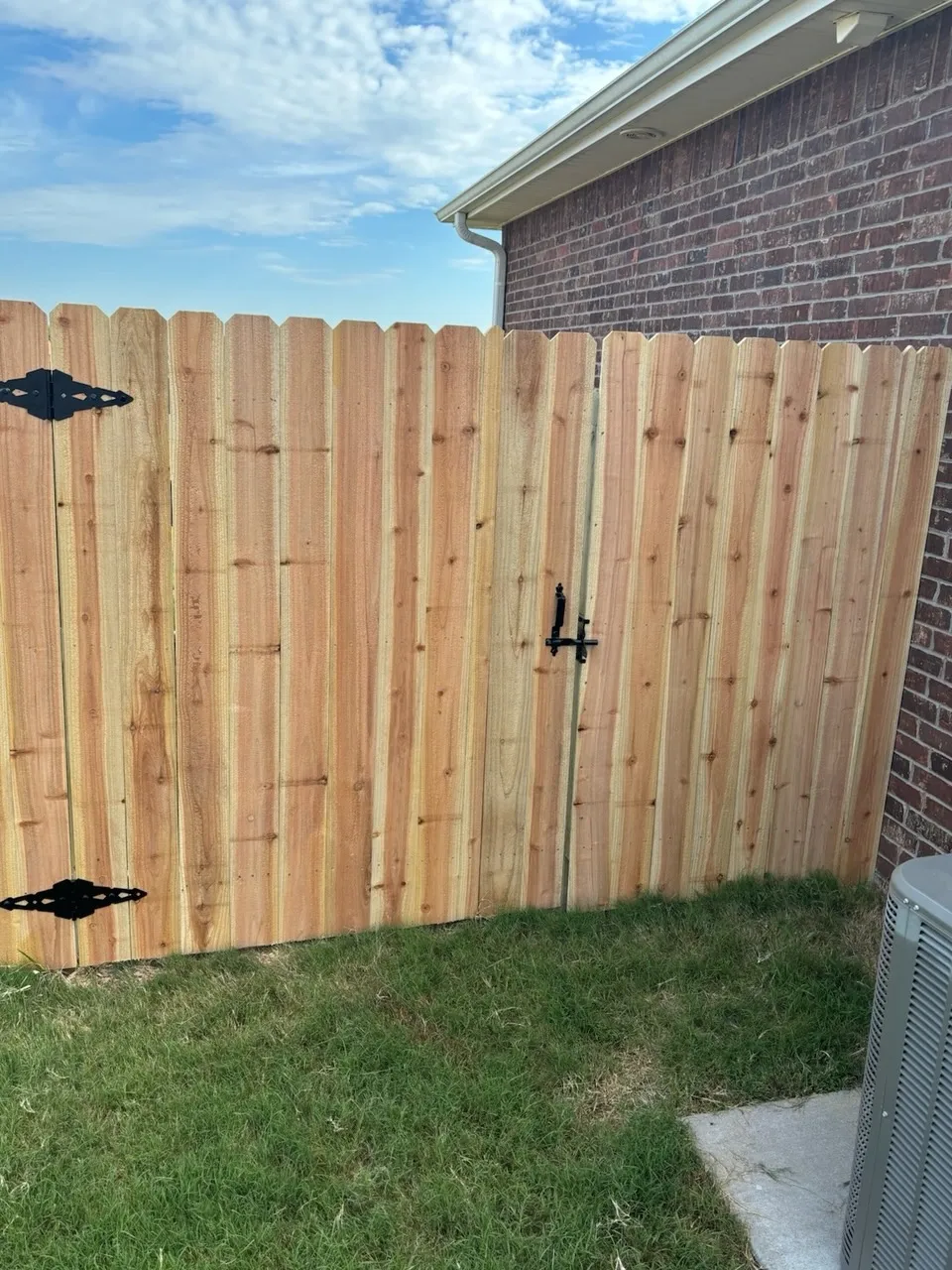 wood stockade fence installed by top rail fence