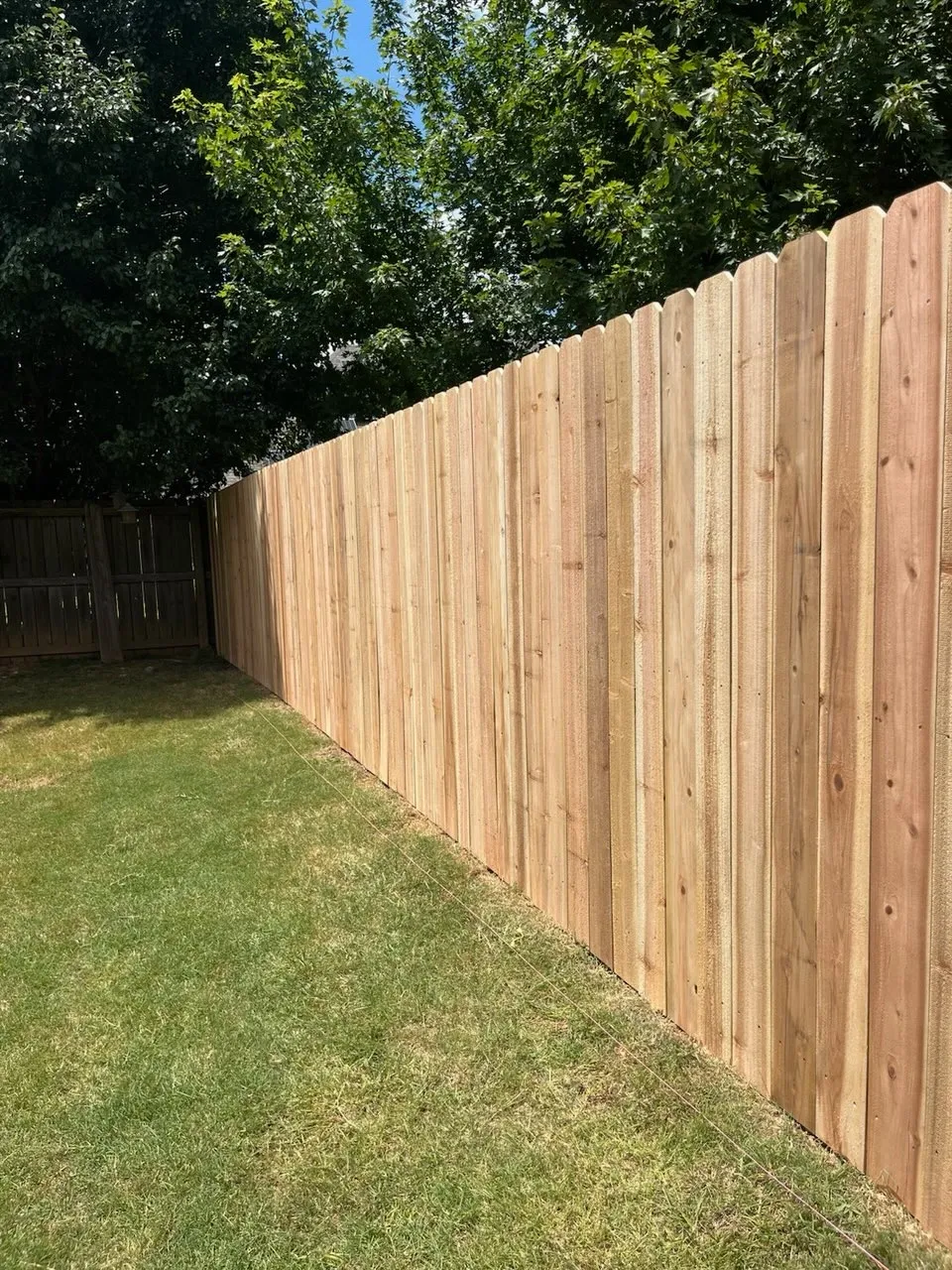 wood stockade fence installed by top rail fence 