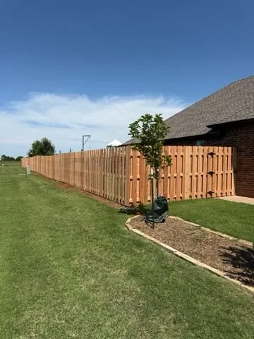 wood shadowbox fence installed by top rail fence