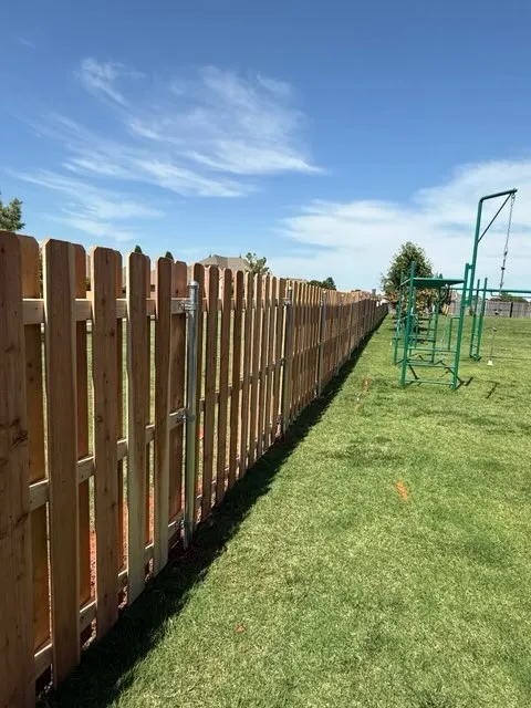 wood shadowbox fence installed by top rail fence