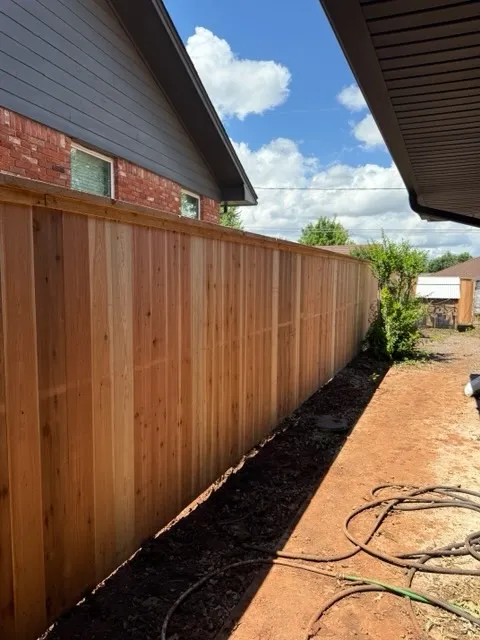 wood privacy fence installed by top rail fence