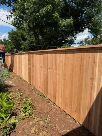 wood privacy fence installed by top rail fence