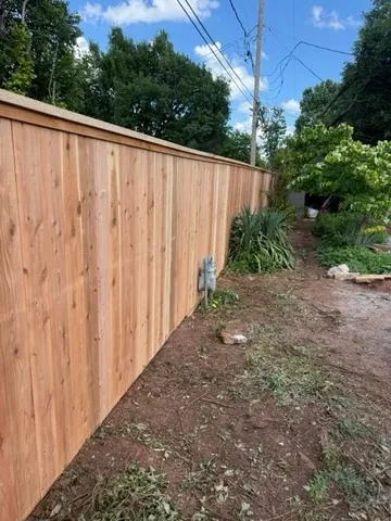 wood privacy fence installed by top rail fence