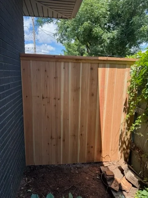wood privacy fence installed by top rail fence