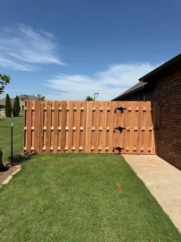 wood shadowbox fence installed by top rail fence