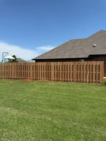 wood shadowbox fence installed by top rail fence