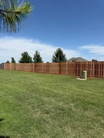 wood shadowbox fence installed by top rail fence