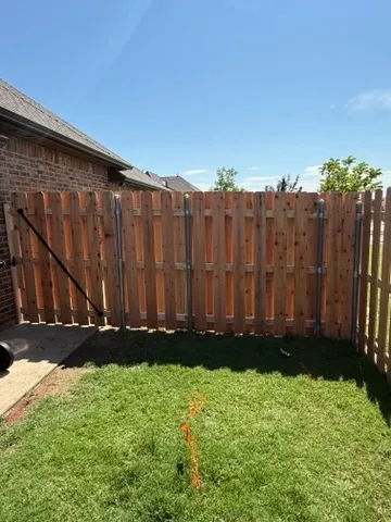 wood shadowbox fence installed by top rail fence
