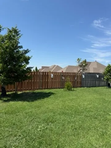 wood shadowbox fence installed by top rail fence