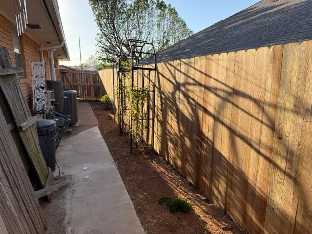 wood stockade fence installed by top rail fence