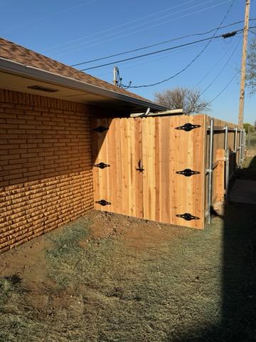wood stockade fence installed by top rail fence
