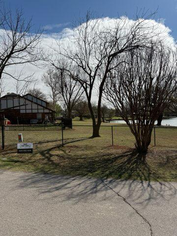 black chain link fence installed by top rail fence