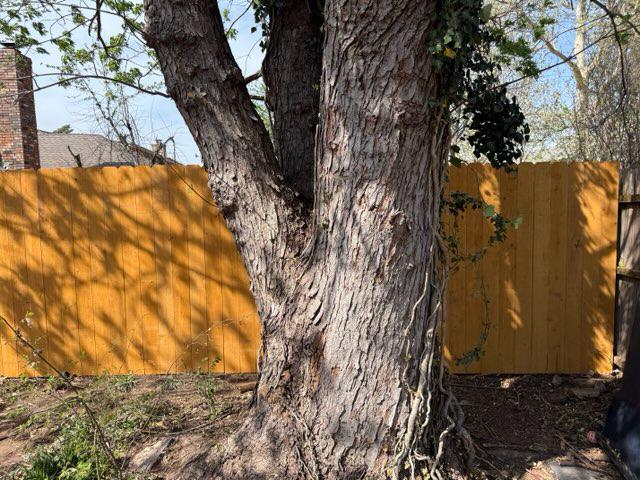 wood stockade fence installed by top rail fence