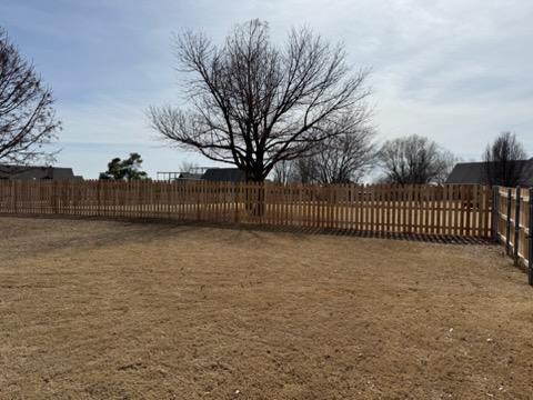 wood picket fence installed by top rail fence