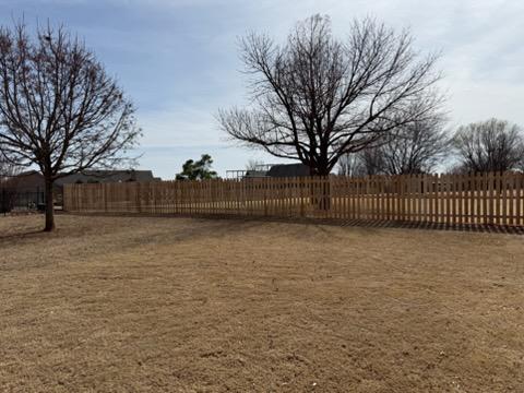 wood picket fence installed by top rail fence