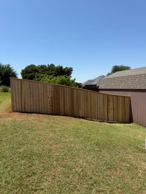 wood privacy fence installed by top rail fence