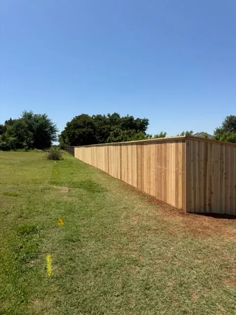 wood privacy fence installed by top rail fence