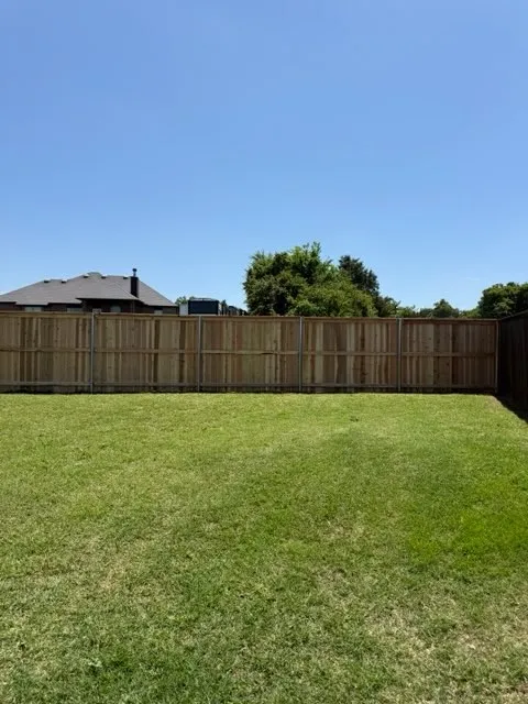 wood privacy fence installed by top rail fence