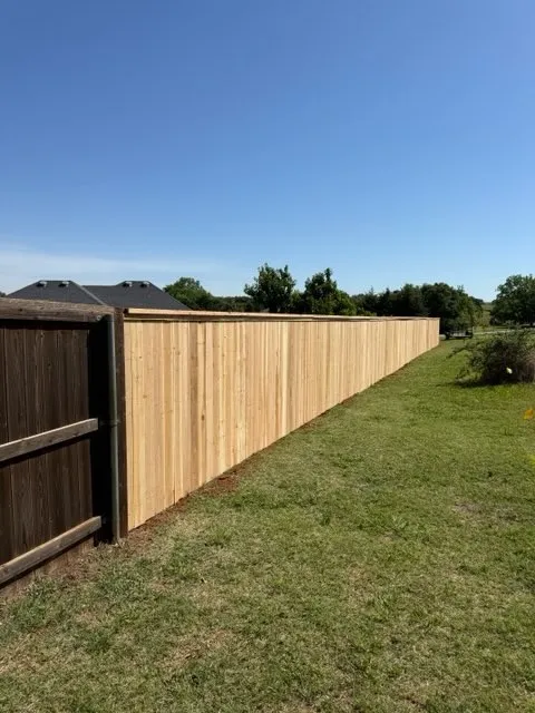 wood privacy fence installed by top rail fence