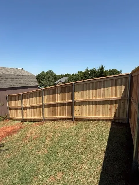 wood privacy fence installed by top rail fence