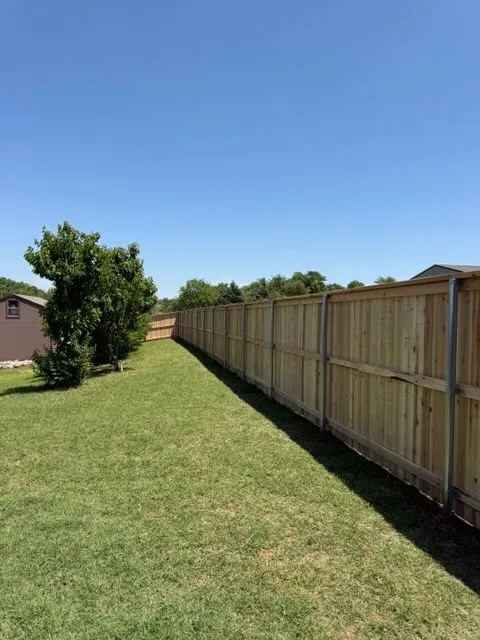 wood privacy fence installed by top rail fence