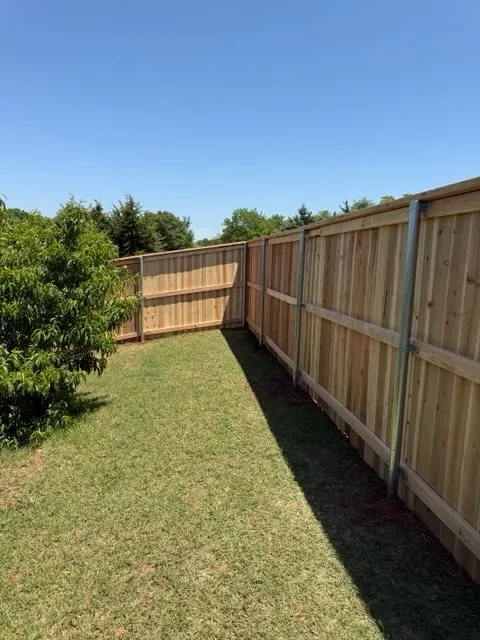 wood privacy fence installed by top rail fence