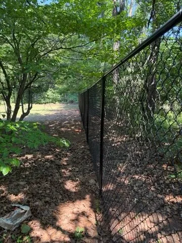 black chain link fence installed by top rail fence